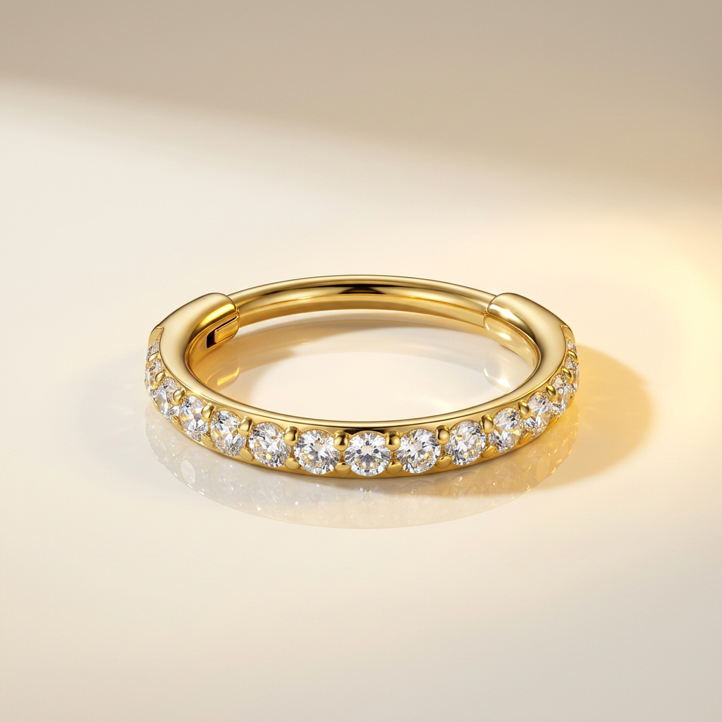 Anneau hinged 20G pavé de zircons en titane doré PVD. Pour conch ou nez. Pièce ÖVA.