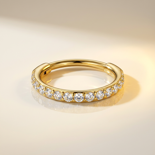 Anneau hinged 20G pavé de zircons en titane doré PVD. Pour conch ou nez. Pièce ÖVA.